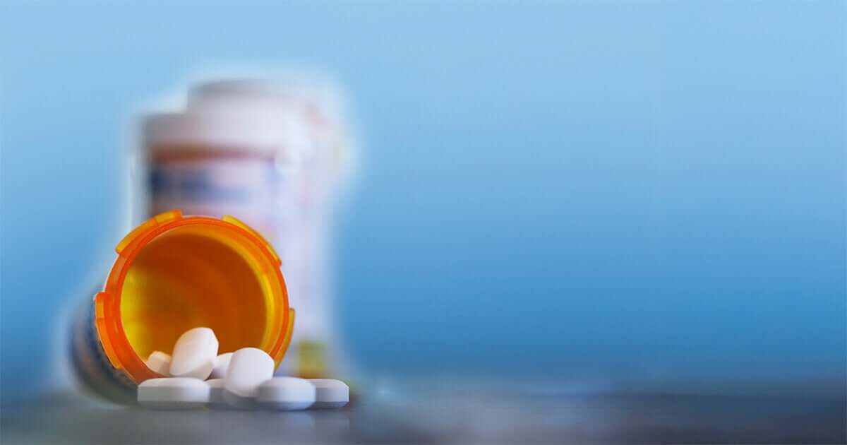 An open bottle of generic pills